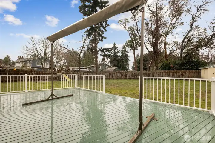 Relax on the back deck under the SunSetter awning which stays with the home. Perfect for summer evenings!