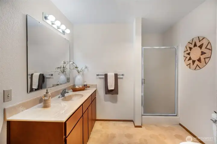 Large, bright bathroom with full tub & 3/4 shower