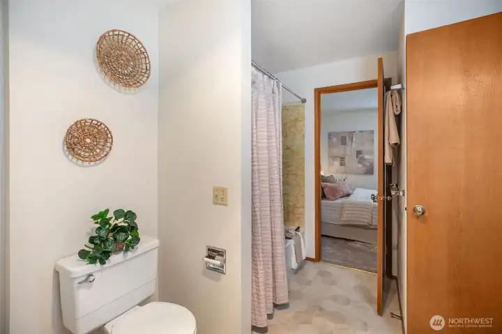 Large, bright bathroom with full tub & 3/4 shower