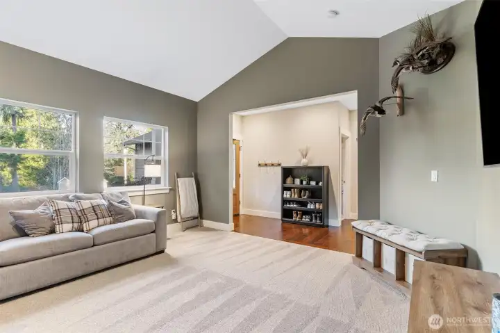 Abundant light in your front living space with vaulted ceilings