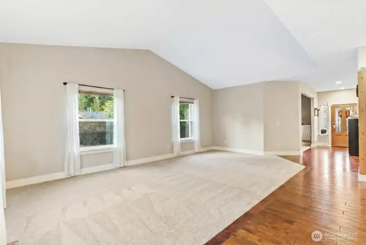 Vaulted ceilings, natural light, open to kitchen and dining room