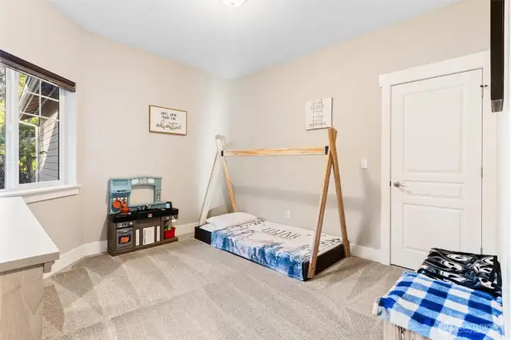 Bedroom 2 near the main living space. Potential office or gym.