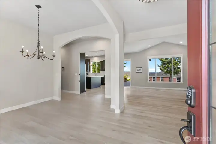 Beautiful open concept! This home features  10' ceilings throughout. (Furniture has been  digitally removed.)