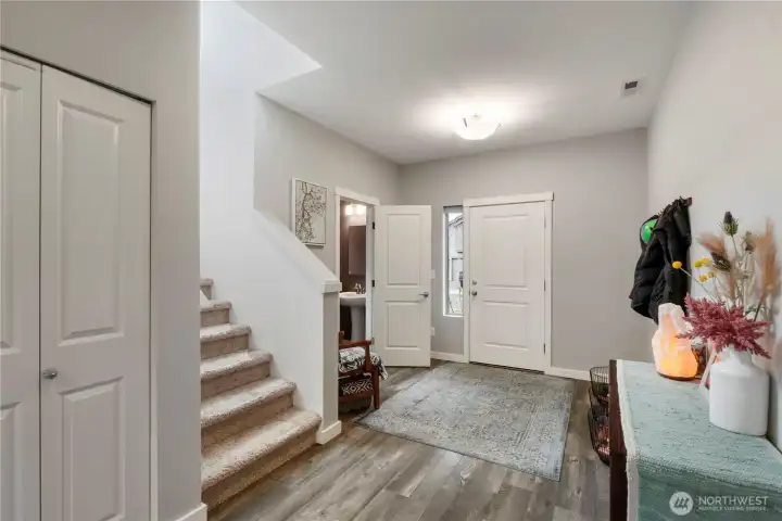 Front entry with powder bath and storage closet