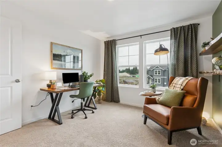 Comfortable secondary bedroom with abundant natural light.