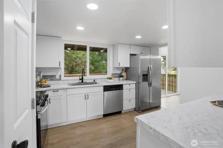 New farm sink with view to peaceful backyard