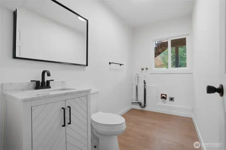 Half bath and laundry room downstairs