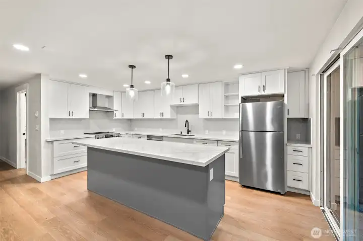 Chic and modern kitchen with Quartz countertops and kitchen island.