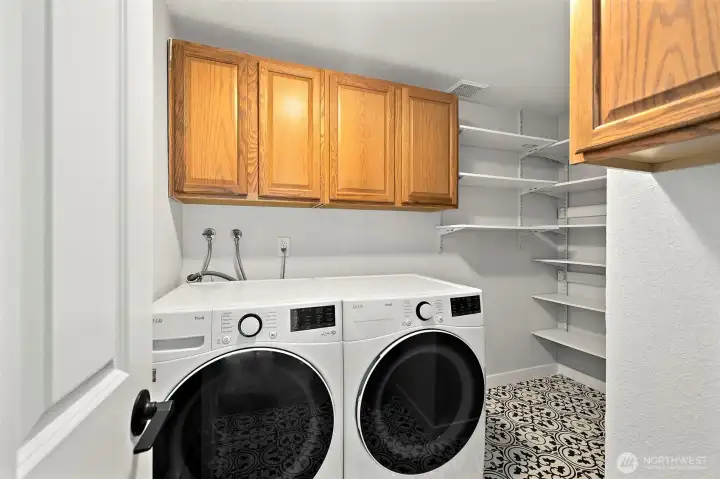 Walk-in Utility Room with matching LG Washer and Dryer.