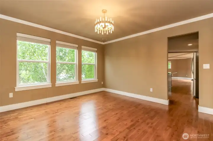 Large windows and abundant natural light create a warm and inviting atmosphere throughout the main level.