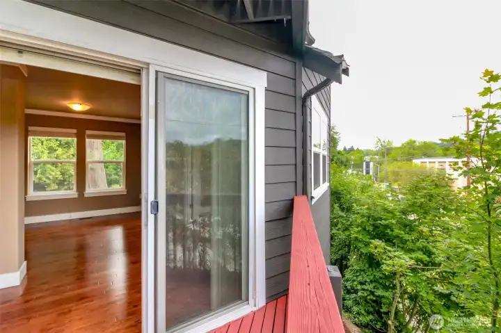 Enjoy fresh air and neighborhood views from the private deck just off the main living area.