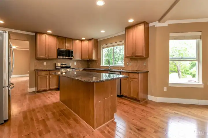 Chef's Kitchen  Expansive kitchen featuring granite countertops, stainless steel appliances, and abundant cabinetry.