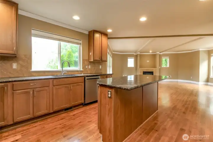 Open kitchen overlooks the spacious great room, making gatherings effortless.