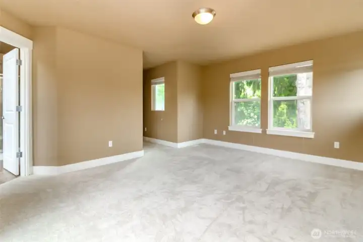 Generous bedroom dimensions provide comfort and flexibility for furnishings.