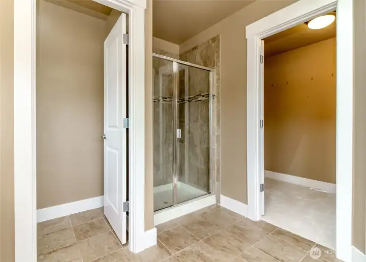 Spacious walk-in closet conveniently connected to the primary bathroom.