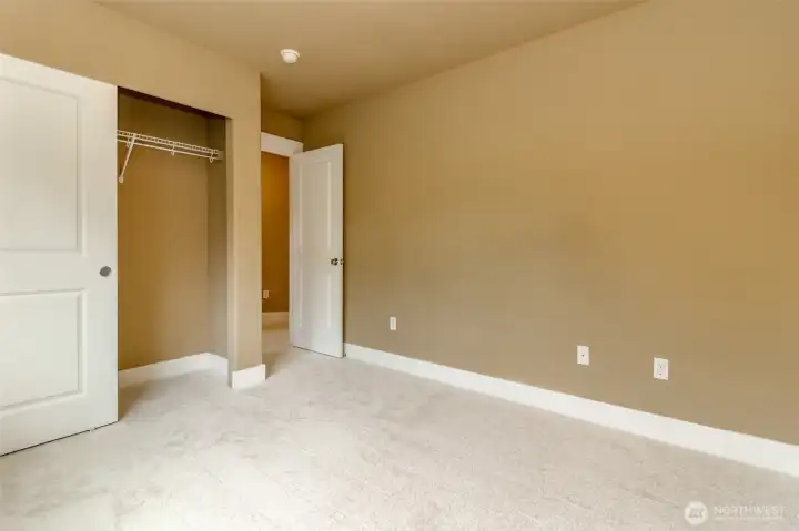 Spacious bedroom complete with easy-access closet and thoughtful layout for comfortable living.
