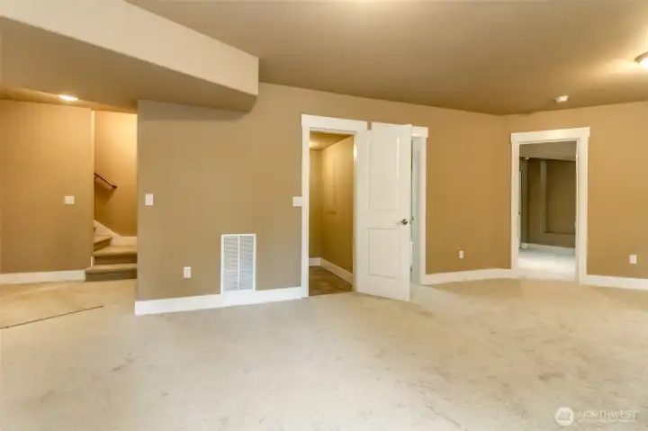 Open-concept lower level provides endless possibilities for entertaining, hobbies, or multigenerational living.