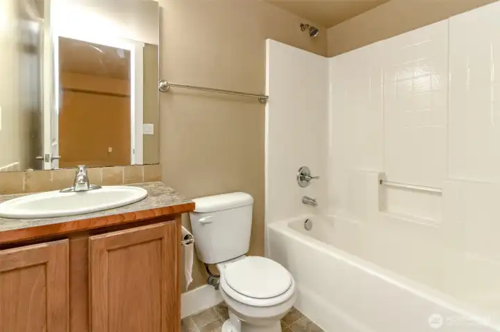 Additional full bathroom offers comfort and convenience for guests and lower-level living spaces.