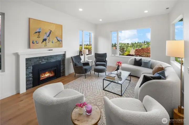 Flooded with natural light, the main level offers an ideal open-concept floorplan with soaring 10-foot ceilings and wide-plank white oak flooring throughout.