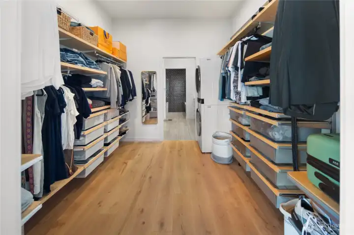 Primary Walk-in closet w/ conveniently place launry.