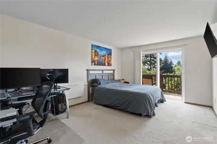 Primary bedroom with its own deck overlooking the territorial view Primary bedroom with its own deck overlooking the territorial view