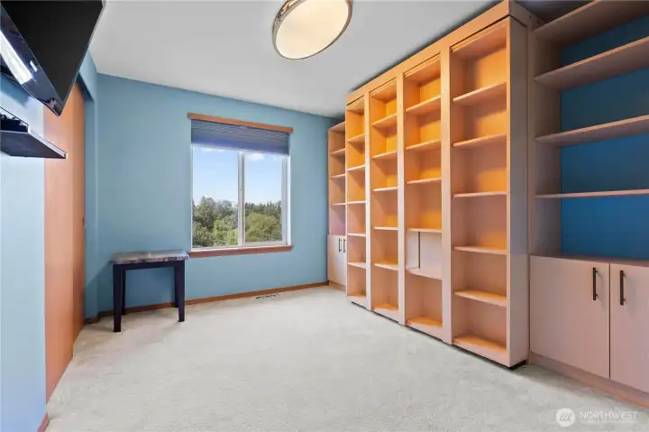 Bedroom three features a murphy bed that pulls down from the wall Bedroom three features a murphy bed that pulls down from the wall