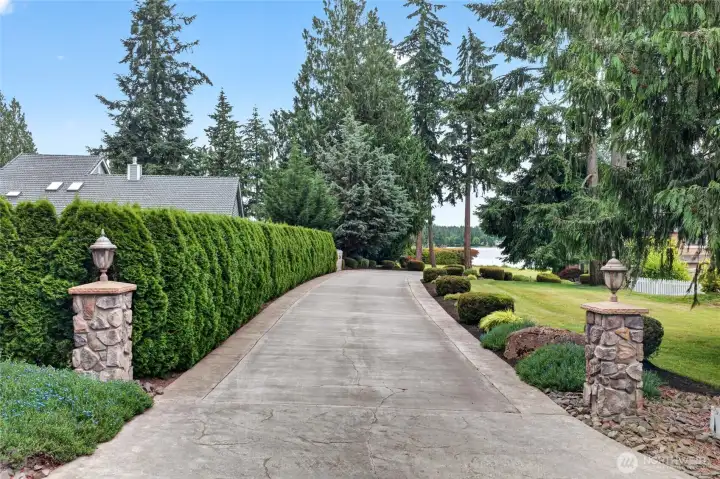 Long private driveway to this 4000+ square foot home perfectly situated on the lake and golf course with Mt Rainier view