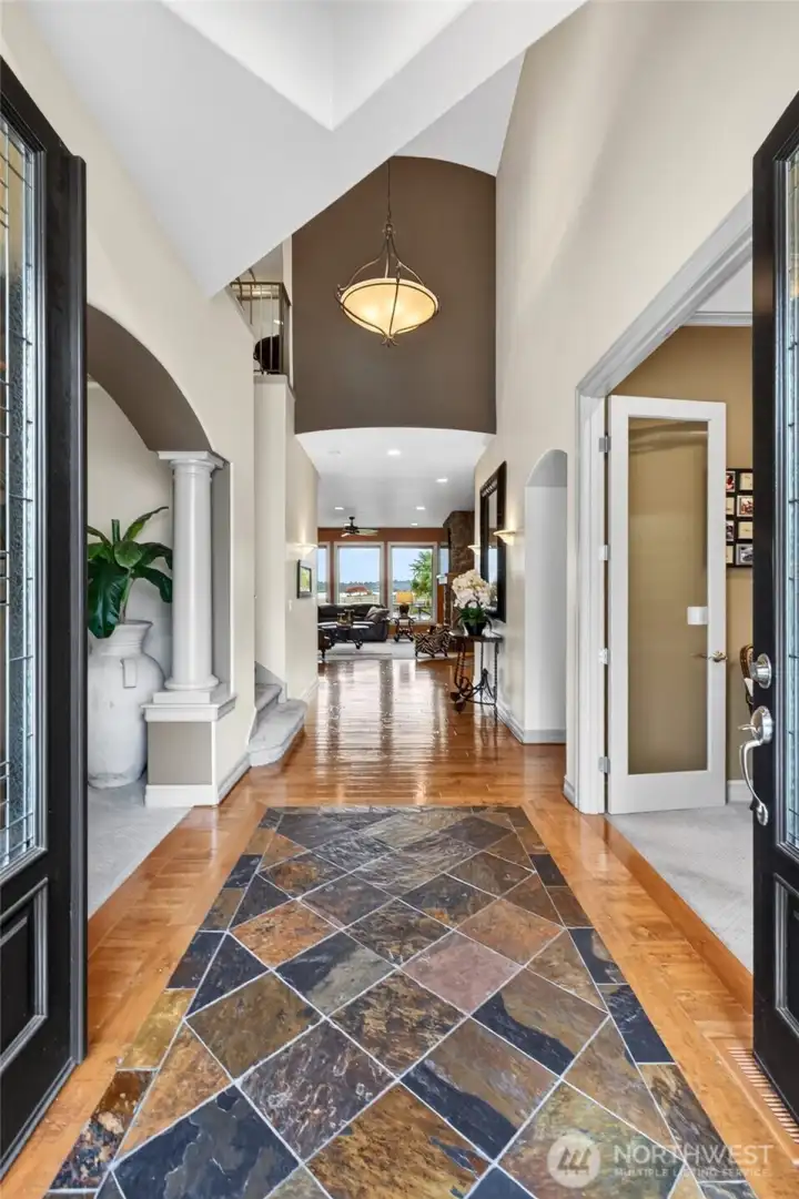 Welcome into soaring ceilings and light and bright entry