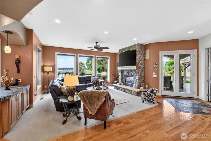 Stone fireplace and French doors to covered patio