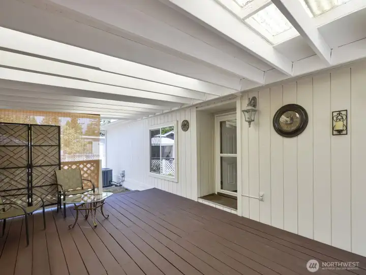 There's a fully covered, enclosed spacious deck in addition to the fabulous enclosed 'outdoor living space' the sellers have created on the other side of the home.