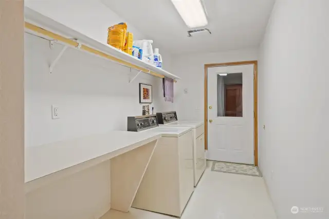 Spacious laundry room with door to small deck, alternate entry deck.