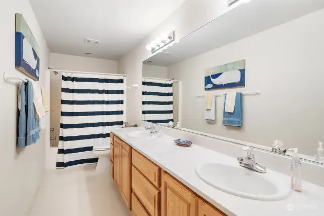 Full bath with double sinks.