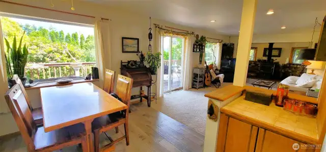 This light-filled living space seamlessly blends relaxation and inspiration—offering an open flow from dining to lounging to the outdoors. Whether you’re enjoying morning coffee by the garden-view window, enjoying a night by the fire or stepping onto the deck for an evening breeze, every corner invites you to slow down and savor Nahcotta’s coastal charm.