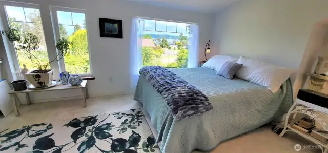 Bask in the quiet elegance of this garden-view guest room — where dappled light filters through generous windows, framing Willapa Bay views, and lush outdoor vistas.