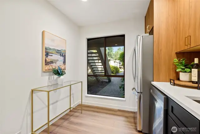 Updated kitchen with a bright open window for lots of natural light.