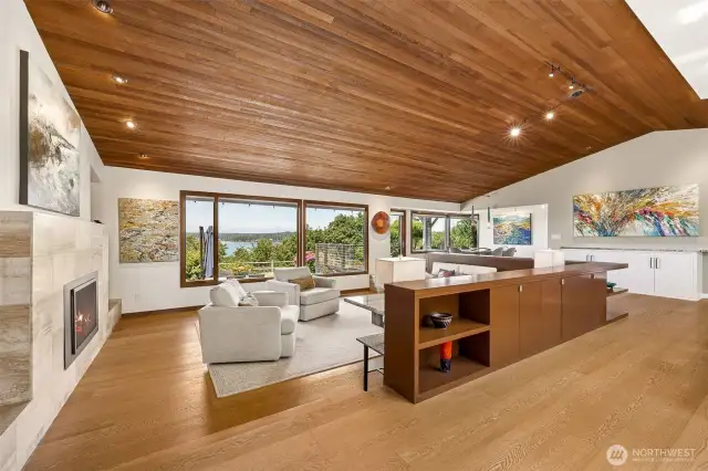 Walls of windows flood the great room with light and the view is even better in person!