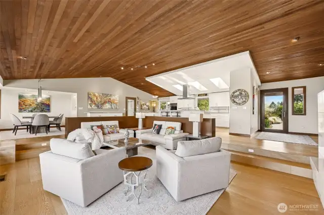 Vaulted, cedar ceilings in the great room, with KentWood Oak Sanderson, wide plank brushed, engineered, FSC  certified flooring.