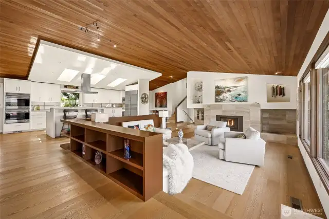 Great room features a Kozy Heat Chaska 34” propane fireplace with travertine  fascia & display areas
