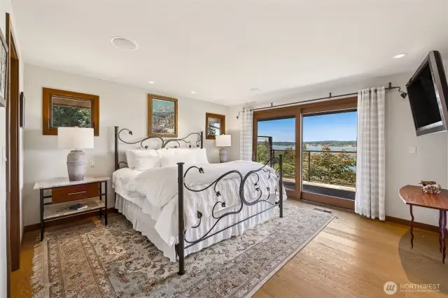 Primary bedroom features private deck and walk-in closet.