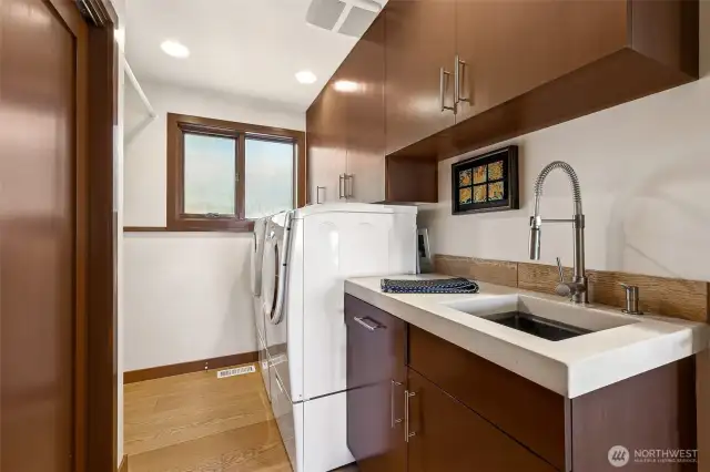Utility room on lower level with NatureCast Elegance cement counter and Torino undermount stainless sink.