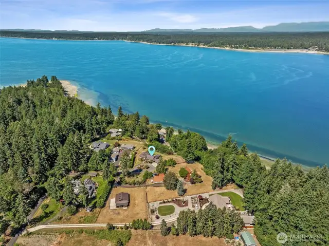 An aerial view of the entirety of the estate, with the large shop/garage/barn in the foreground and the home marked above.
