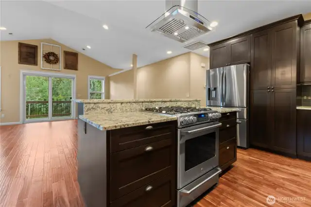 Upper level kitchen with vaulted ceilings.