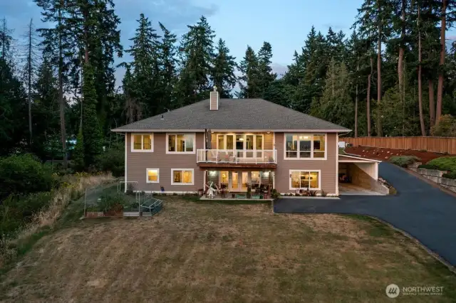 Check out this 2,210 Sq Ft of living space in the fully finished lower level.  This area has it's own 2 car covered parking area and paved driveway. A separate entry, big patio, and full view of the Sound and Mountains!  Quality matches the upper level with a full kitchen and big dining room.  The Great Room has a cozy Gas fireplace.  There are 2 bedrooms sharing a Jack-n-Jill Bathroom and a Powder Bath for guests.  Over 700 sq ft of storage with an exterior door. Perfect generational home or investment with VRBO income! Lots of possibilities ...and enjoy the workshop too!