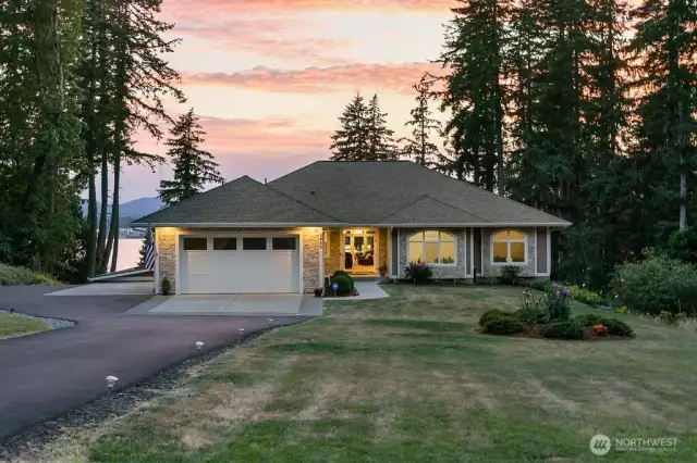 Upper Level:  2,765 Square Feet!  Primary Bedroom features an oversized walk in closet and 5 piece bathroom. Lovely jetted tub for 2 and a separate shower.  The great room has a 10' high trayed ceiling with lighting, a cozy gas fireplace, and open design to the kitchen and dining room. From the entry, there is a double french door to the Den/Office (or your 3rd bedroom) The kitchen features luxury plank flooring, Cherry wood cabinetry with pullouts and deep drawers. SS Double Oven, Refrigerator, and Gas Cooktop. There is a breakfast bar and full dining room~ Perfect for entertaining! The extra deep garage is fully insulated, sheetrocked and painted! The hallway leading from the kitchen to the garage has two coat closets, an expansive laundry room and a full commercial kitchen which was licensed for catering.  Currently used as a hobby room but does contain compartment sinks, a double over, and a cooktop. Would be great for canning fruits and vegetables or your quilting/sewing room