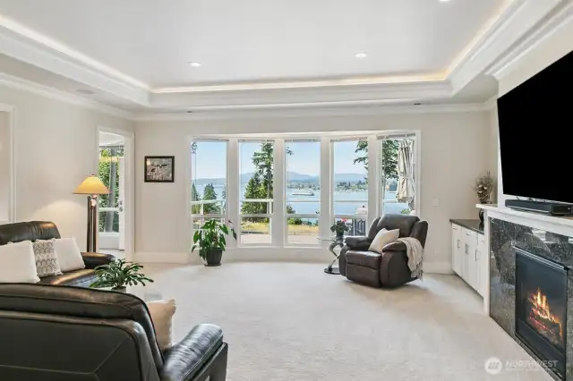 Enjoy the high ceiling with a 'trayed' design which allows for LED lighting.  Upgraded painted trim features throughout the home including 6" - 8" base trim!  This Great Room has a gas fireplace.  Triple Pane Windows offers maximum protection from the sun.