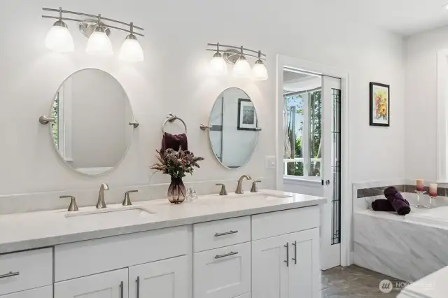 Dual Sinks, Quartz Countertops, and Plank Flooring.