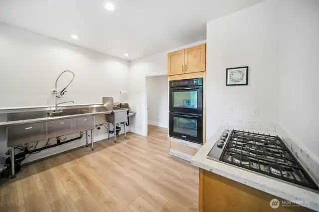This was a licensed commercial kitchen as the owner's had a catering business.  This room is now used for hobbies and is a flex room that can fit your needs for many purposes.  If you have a big garden, you might use this for canning the bounty. Or a seamstress might want to sew or quilt ?  Endless possibilites.
