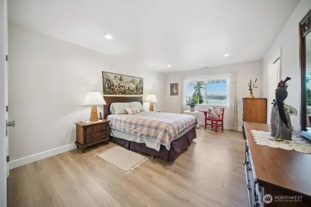 Bedroom 1... solid surface flooring, large window to capture the view, and access to the "jack-n-jill" bathroom area.