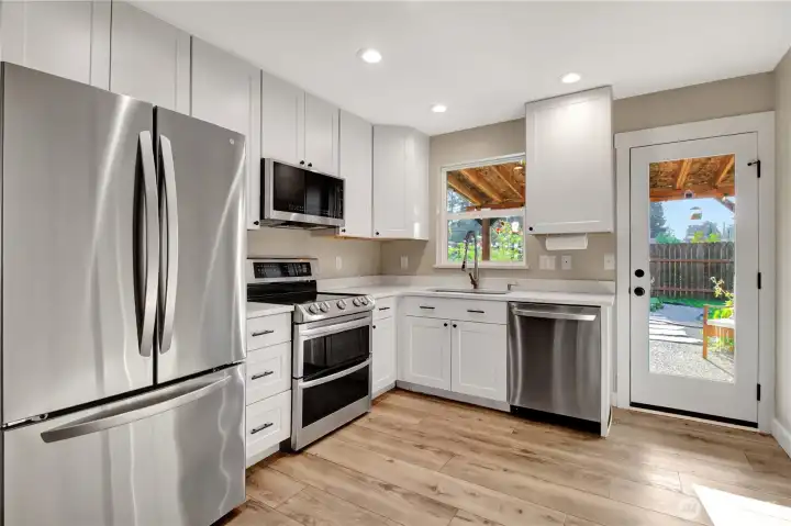 Matching stainless steel appliances throughout the home.