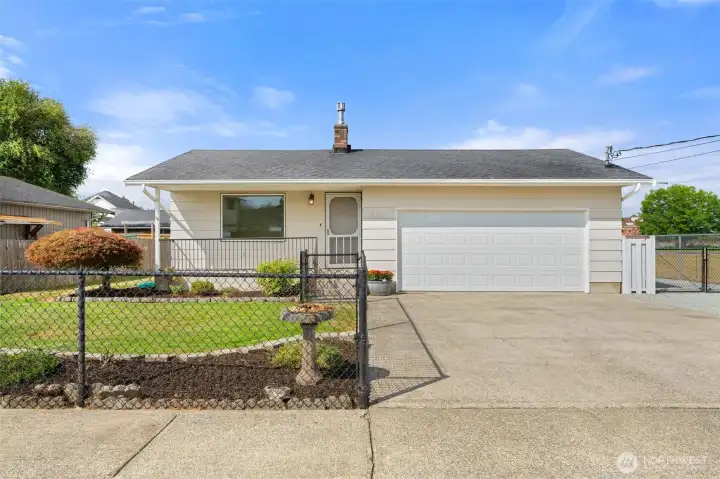Fresh exterior paint and a welcoming front porch.